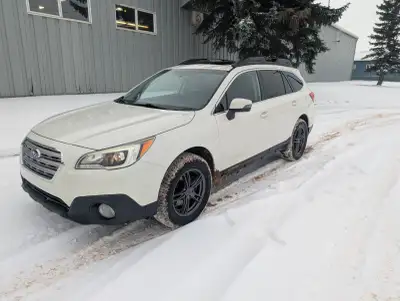 2015 Subaru Outback Touring with 2.5L engine and 6-speed manual transmission. Original owner. Well-e...