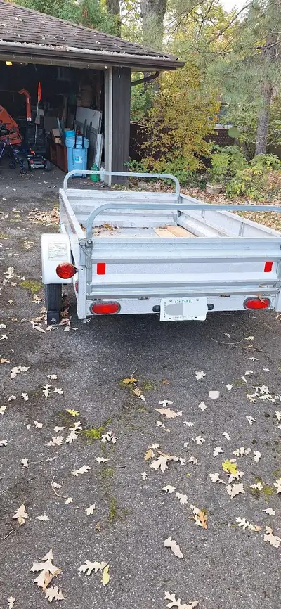 4x7 galvalume utility trailer. Both front and rear gates can be lowered to extend bed length. Tows o...