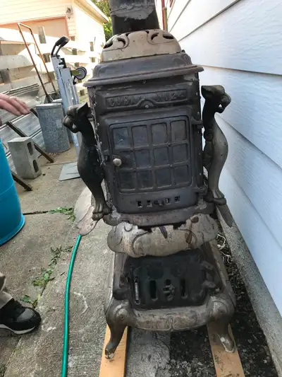 Antique wood burning stove $200. Phone 807-767-3934