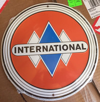 International 12” metal signs $20 each 