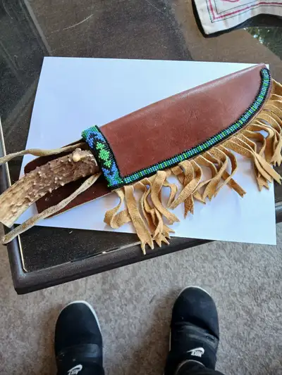 Unique Bowie knife blade with native made sheath and bone handle...one of a kind. Thirteen inches lo...