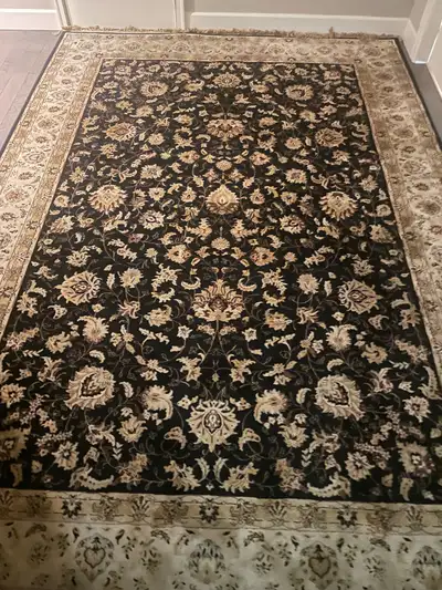 Located in Prince George Black and gold color rug 7’10” x 11’2” great price for a large rug. Belgium...