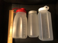  Three plastic Rubbermaid bottles metric/imperial