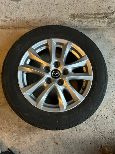 Mazda 3 original rims, set of 4, for sale. I am giving the tires away as well with them, which still...