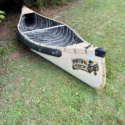 This 12-foot Sportspal canoe is a classic watercraft that is well-loved and ready for some restorati...