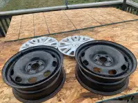 2 Volkswagen rims and hubcaps 30$