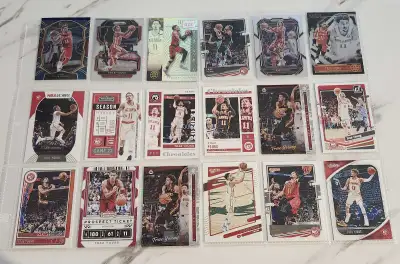 Selling 18 collectible Trae Young basketball cards in EXCELLENT condition comes with album sleeves p...