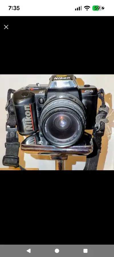 Nikon N4004S  35mm SLR film camera with an attached zoom lens, View more