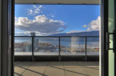 Executive 31st-floor sub-penthouse at Bertram — featuring spectacular Okanagan Lake + Marina views a...