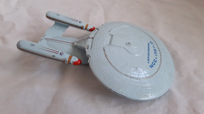 This vintage toy from the Star Trek: The Next Generation TV series does show some wear on the paint...