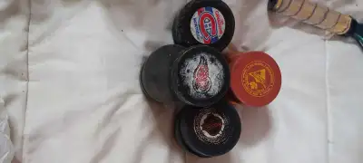 13 hockey pucks, View more