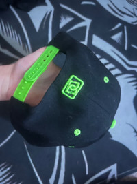 DC green and black hat