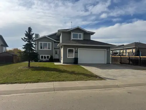 Spacious 5 bedroom Family Home with 3 up and 2 down Attached Garage located 10115 93rd St. Sexsmith...