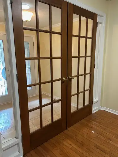 Solid wood French doors pair. 32" x 80". Clear glass. Hinges and handles included.