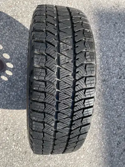 Selling a complete set of 4 Bridgestone winter tires mounted on 15-inch steel rims. Tire size: 195/6...