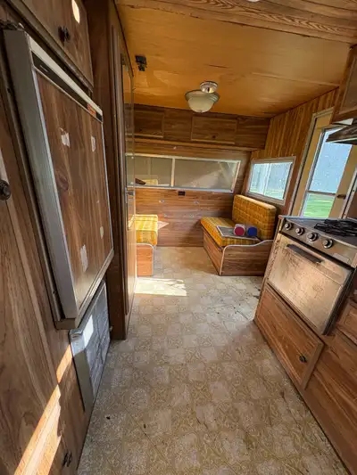 This charming, vintage-style used travel trailer features a cozy interior layout with a functional k...