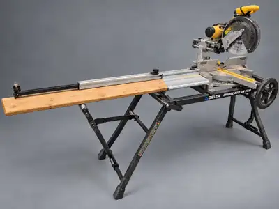 Closing shop. 12-inch sliding DeWalt MITRE saw. Come with stan and stopper.