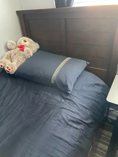 This is a twin bed with a mattress, perfect for a child's room or a guest room. It has been gently i...