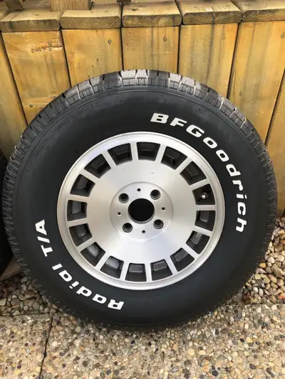 Classic early 80s Ford 4 lug (4x108)aluminum alloy rims. Almost new 215 70 R14 tires. BF Goodrich ra...