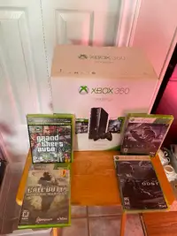 X Box 360. Never used .4 xtra games including Grand theft auto.