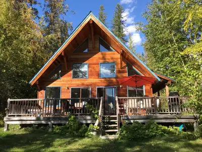 Enjoy the quiet beauty and warm comfort of this well-furnished and much loved home. Surrounded by na...