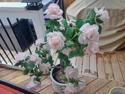 This lovely pink artificial rose plant from Homesense brings a touch of floral elegance to any space...