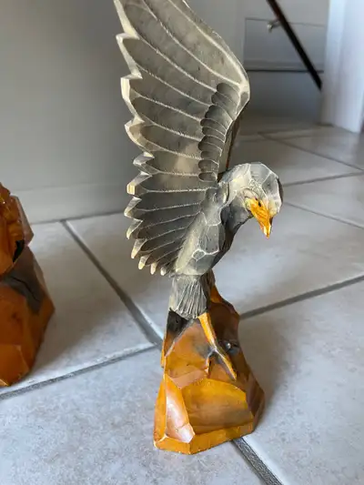 Or hawk. Not exactly sure. Hand carved. Solid wood. Artist unknown. Approximately 11” tall. Make me...