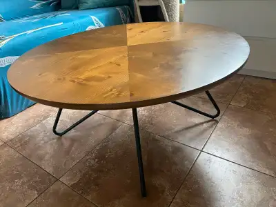 40” Industrial Solid Wood Round Coffee Table. A simple mid-century-inspired round coffee table with...
