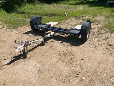 Car dolly. Includes tie down harness and spare tire & wheel.