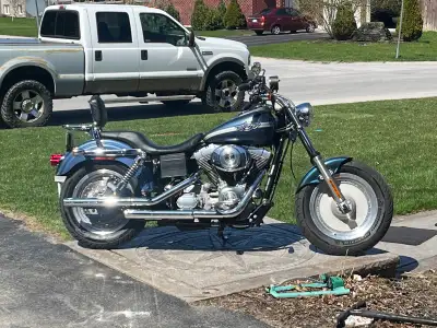 Wide glide front end Fat boy wheels Vance & Hines pipes Jetted New Michelin rubber New battery Saddl...