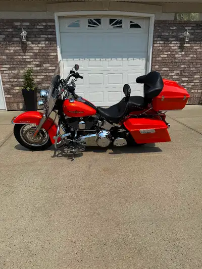 Bike is in showroom condition. A must see. Removed leather saddle bags and installed Harley Davidson...