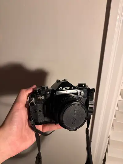 Canon A1 Film Camera + goodies, View more