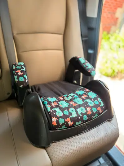 Cosco juvenile booster seat, with cup holder, washable cover and arm rest covers, seat belt slots