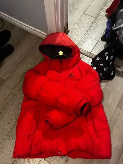 Bright red Jordan skiing jacket. Looking for 100 or best offer, could be a trade too