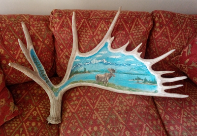 Beautiful painting of moose in mountains on a 14 point naturally shedded moose antler. 3 feet wide