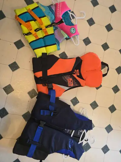 I'm selling a collection of used youth life jackets, perfect for keeping your little ones safe on th...