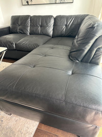 Black leather L section sofa 