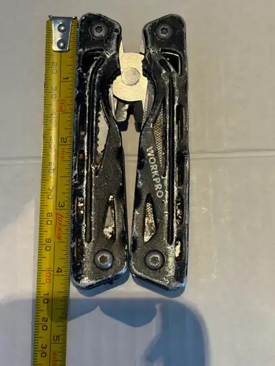K105 Multi-Tool WorkPro 12-IN-1 Multi Tool, Aluminum handle,Stainless Steel, Asking: $15.00 Conditio...