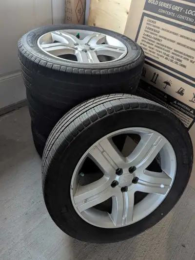 All season tires (Michelin Defender) on alloy rims. Size 225/55R17. Good condition with lots of trea...