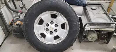 Set of 4, 265/70R17 tires and Silverado aluminum rims. Tires are Michelin Defender 2. Rims are servi...