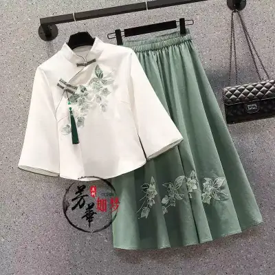 This is a modern Chinese Tang suit two-piece set combining a modified cheongsam-style top and a midi...