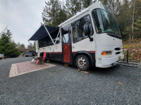 Professionally converted bus with 8 ft garage with ramp 