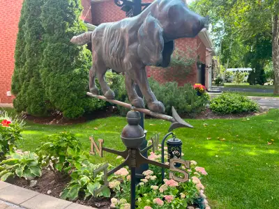 Let this doggy point where the wind is blowing.. Copper Dog on top of a copper directional indicator...
