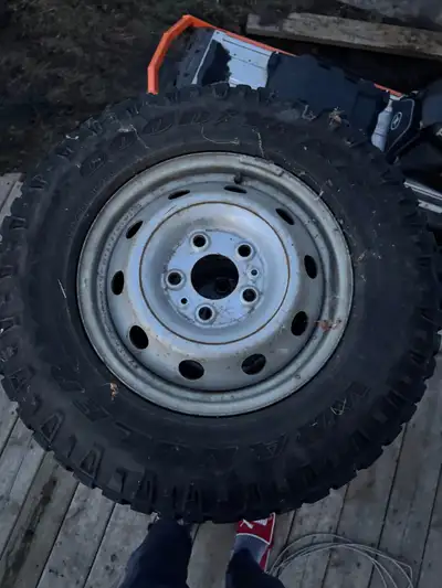 Set of 4 Goodyear Wrangler tires and 16” rims off a Dodge Promaster 1500 van Tires are studed and in...