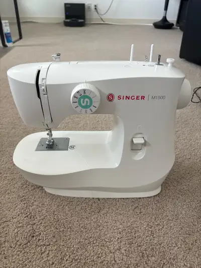 - M1500 Singer Sewing Machine (perfect condition) (retails for $200 CAD) - Includes electronic foot...