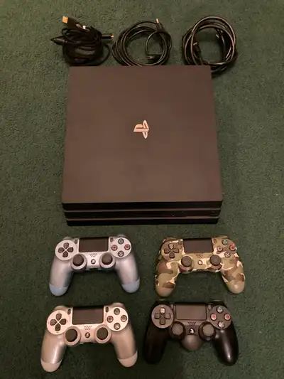 PS4 PRO + 4 Controllers + 1 Back Button Attachment + 8 Games, View more