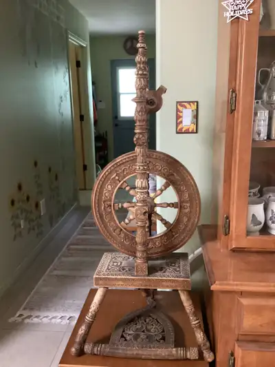 Beautiful hand carved wooden spinning wheel. In working order. Located near Stony Plain. Call 780-96...
