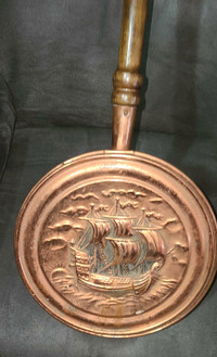 Antique copper and wood bed warmer.