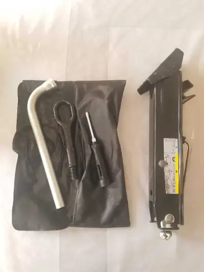 Car Hand Jack & Spare Tire Tools. All in great condition. Only used once.