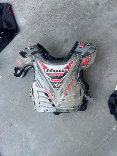 Motocross chest protection, pants and two shirts for adult or larger teen. $20 chest protector $20 p...